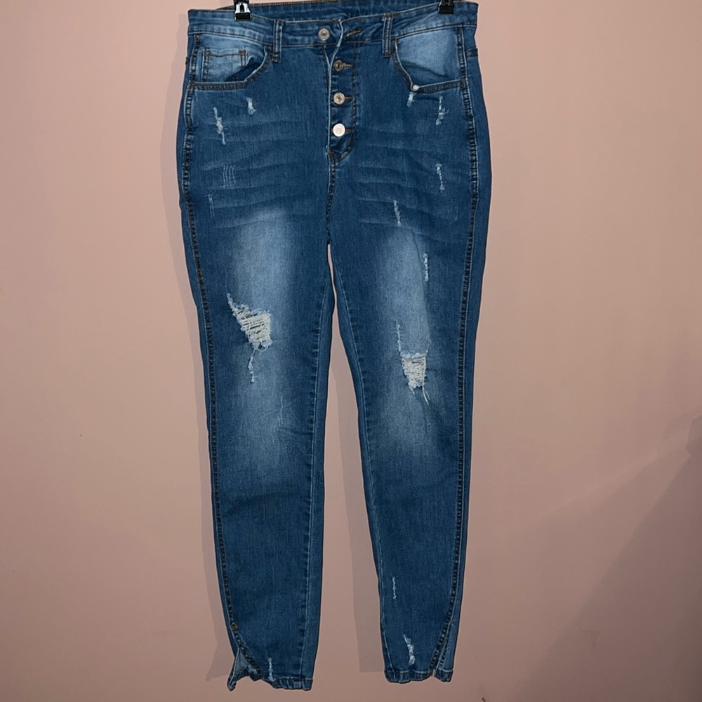 extra stretch distressed skinny button fly  ankle slit jeans.